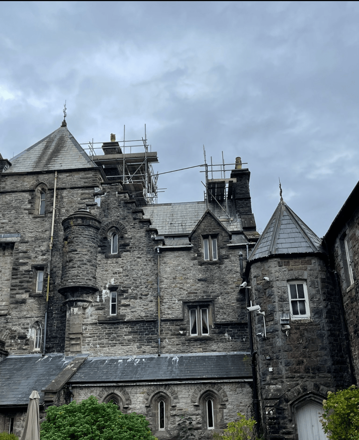 a stone castle with scaffolding